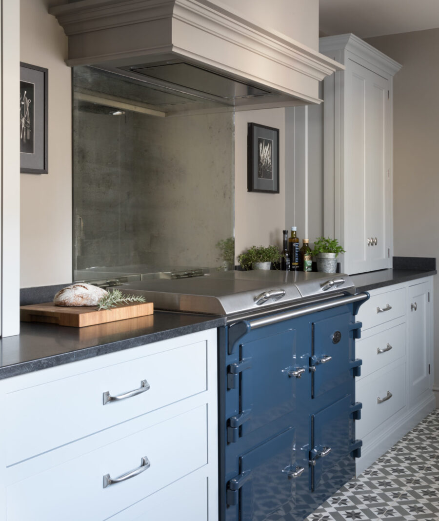 The design of this kitchen cooker hood blends seamlessly with nearby bespoke cabinetry  