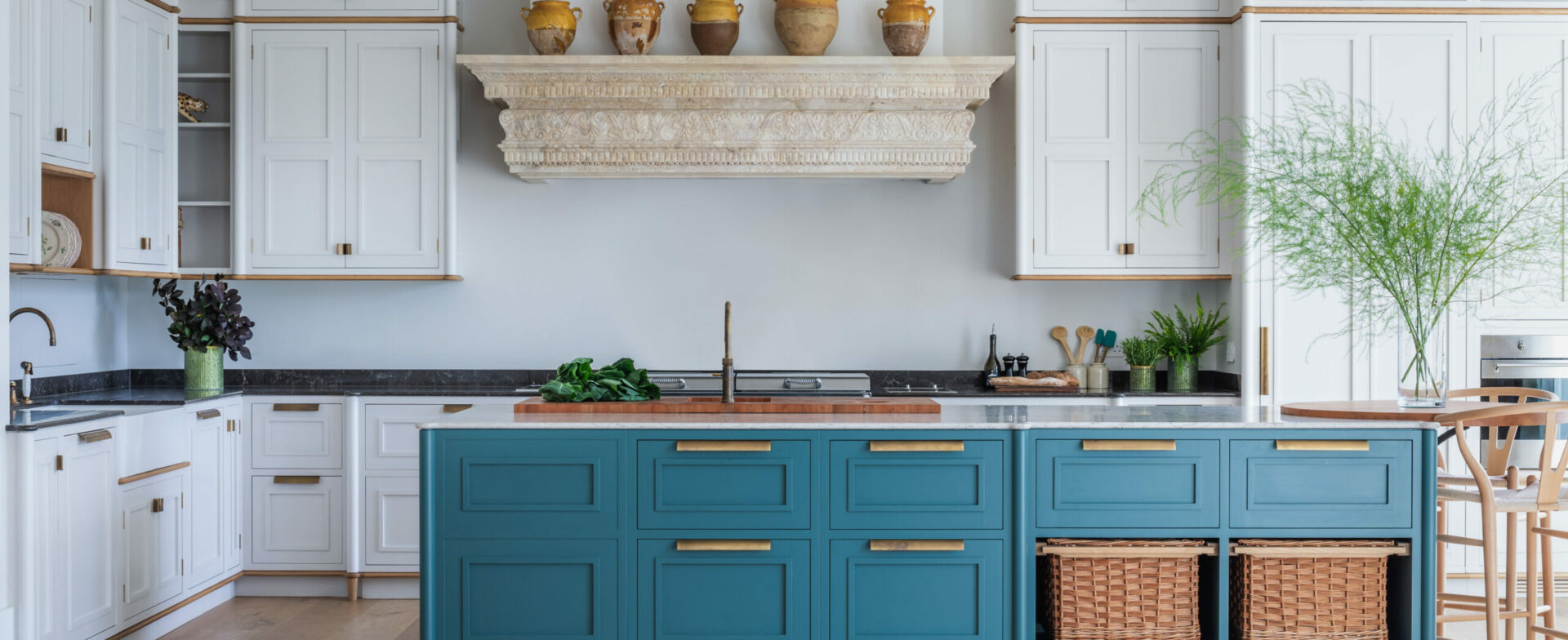 Hand painted kitchen with carved stone lintel