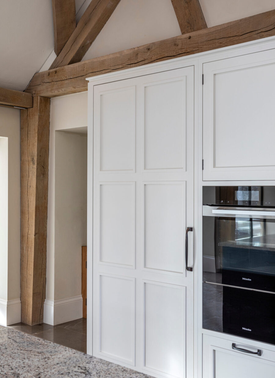 Miele appliances sit within the wall of bespoke cabinetry Miele appliances sit within the wall of bespoke cabinetry