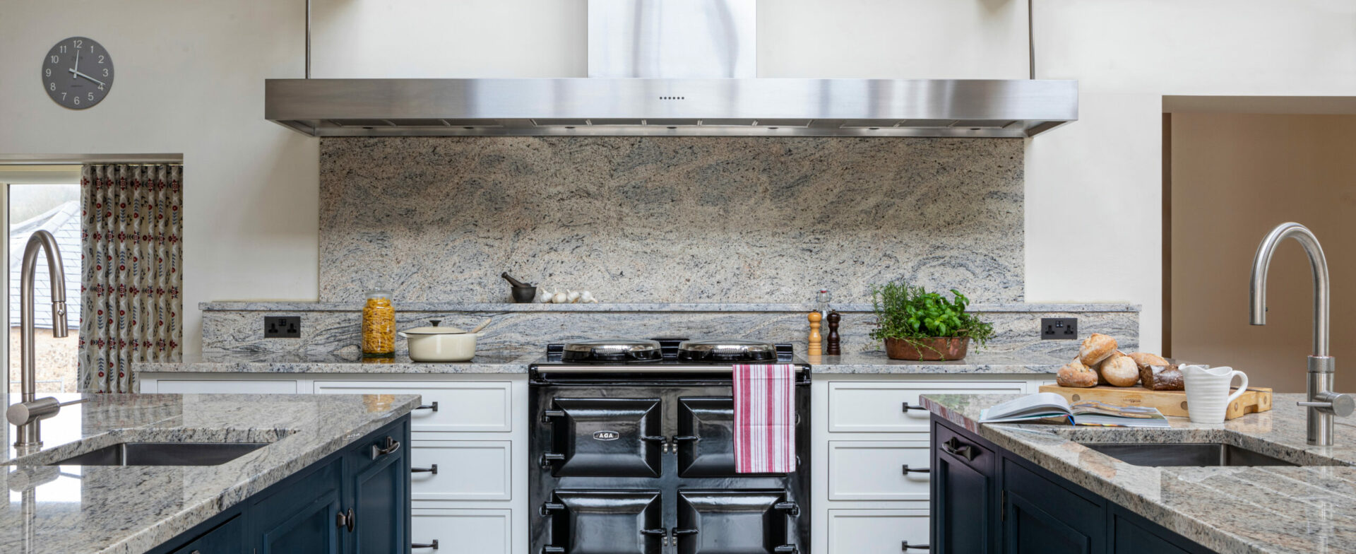 Black AGA with two kitchen islands