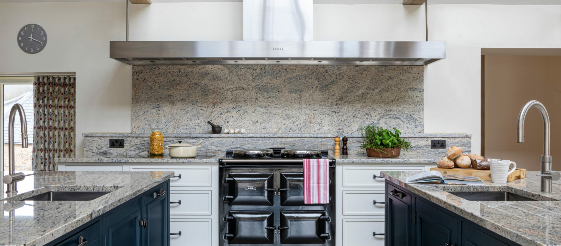 Black AGA with two kitchen islands