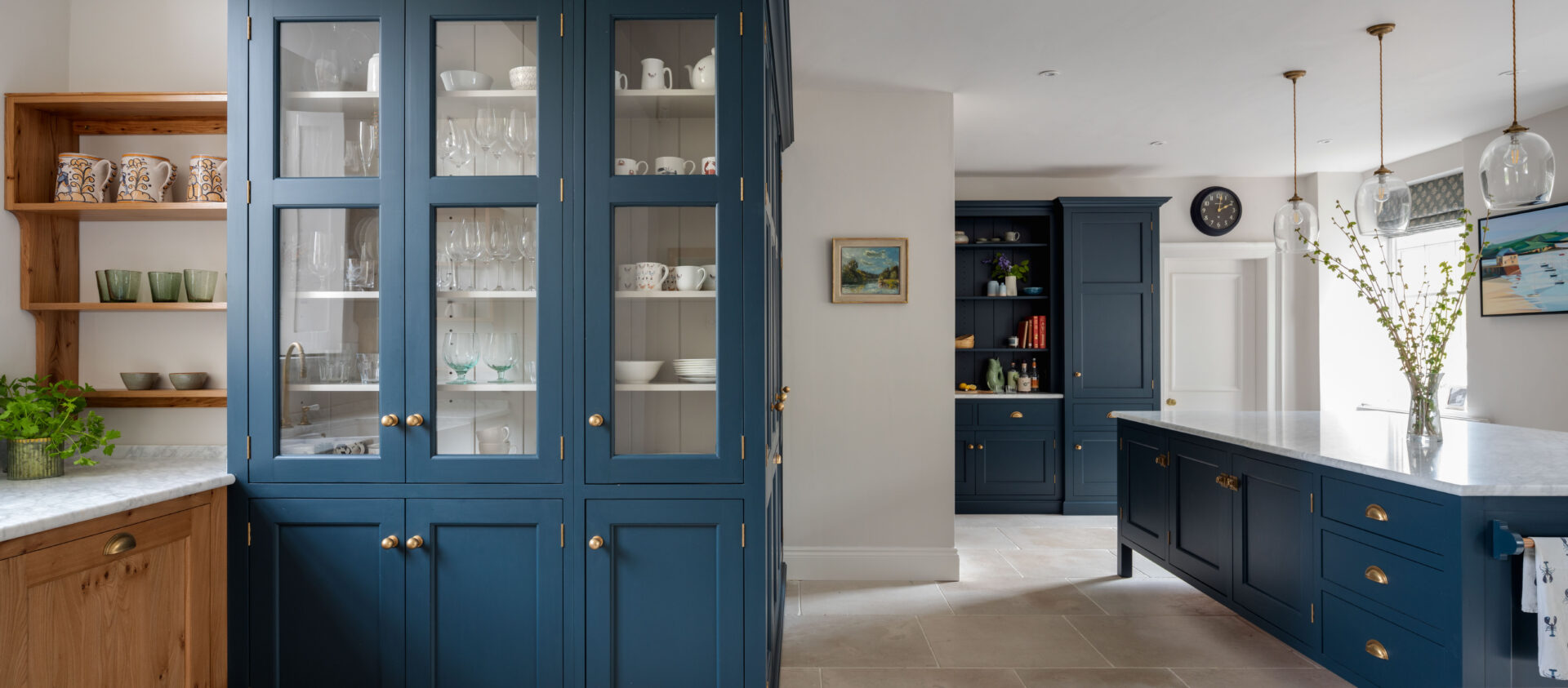 Large blue kitchen cabinet with glazed doors