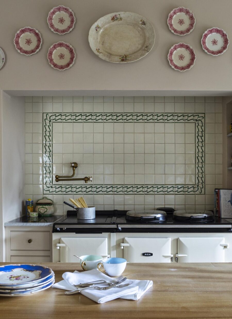 The AGA sits one side of the Cook's table kitchen island The AGA sits one side of the Cook's table kitchen island