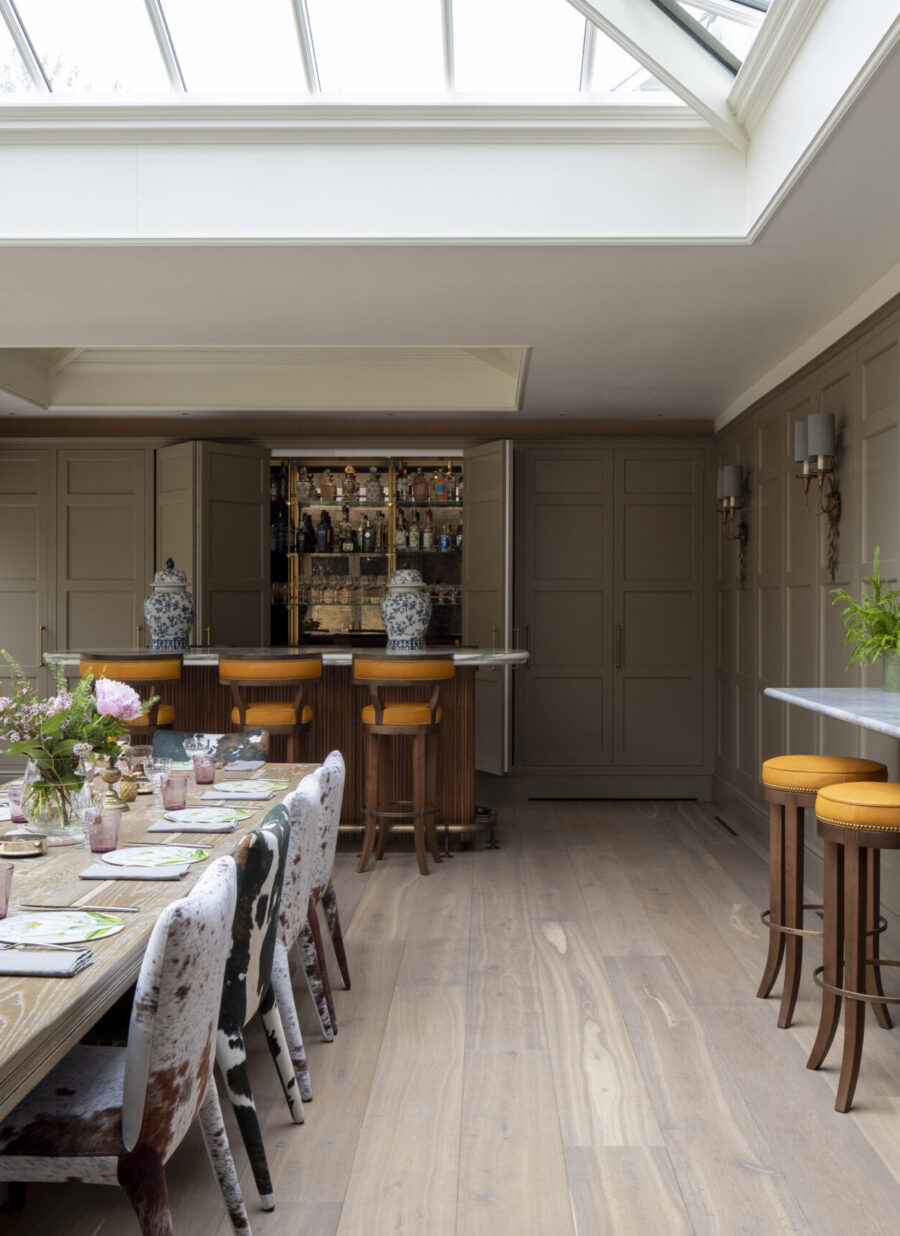 The bespoke cocktail bar sits at one end of an Orangery extension The bespoke cocktail bar sits at one end of an Orangery extension