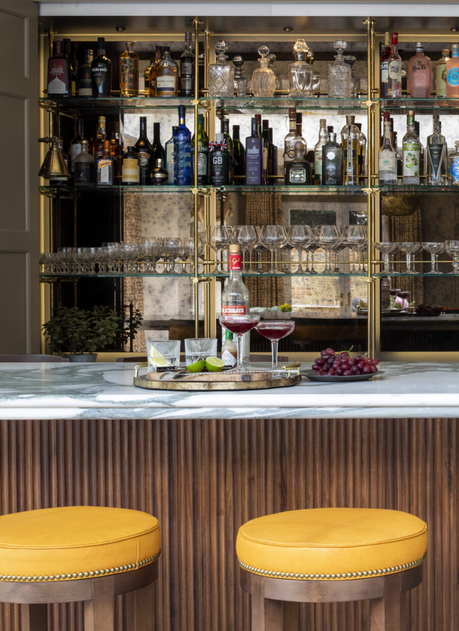 Antique mirrored glass sits behind the display shelves Antique mirrored glass sits behind the display shelves