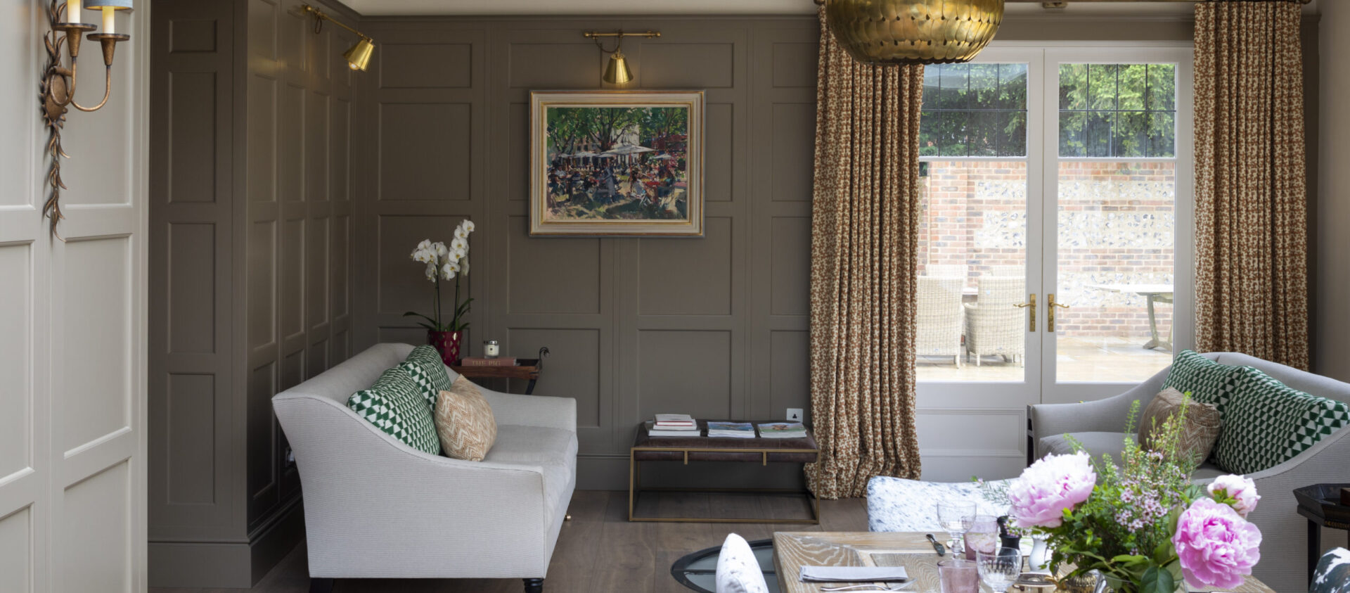 Hand painted wall panelling with sofas and coffee tables in the cocktail bar seating area