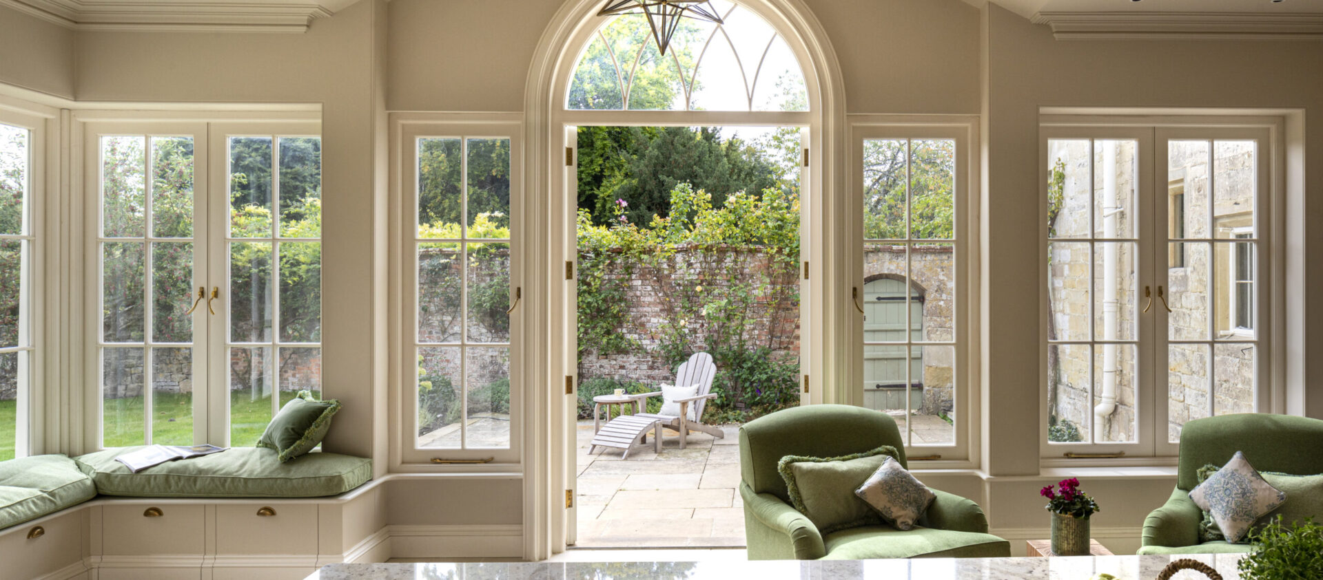 A new orangery extension floods light in tot his Georgian house kitchen