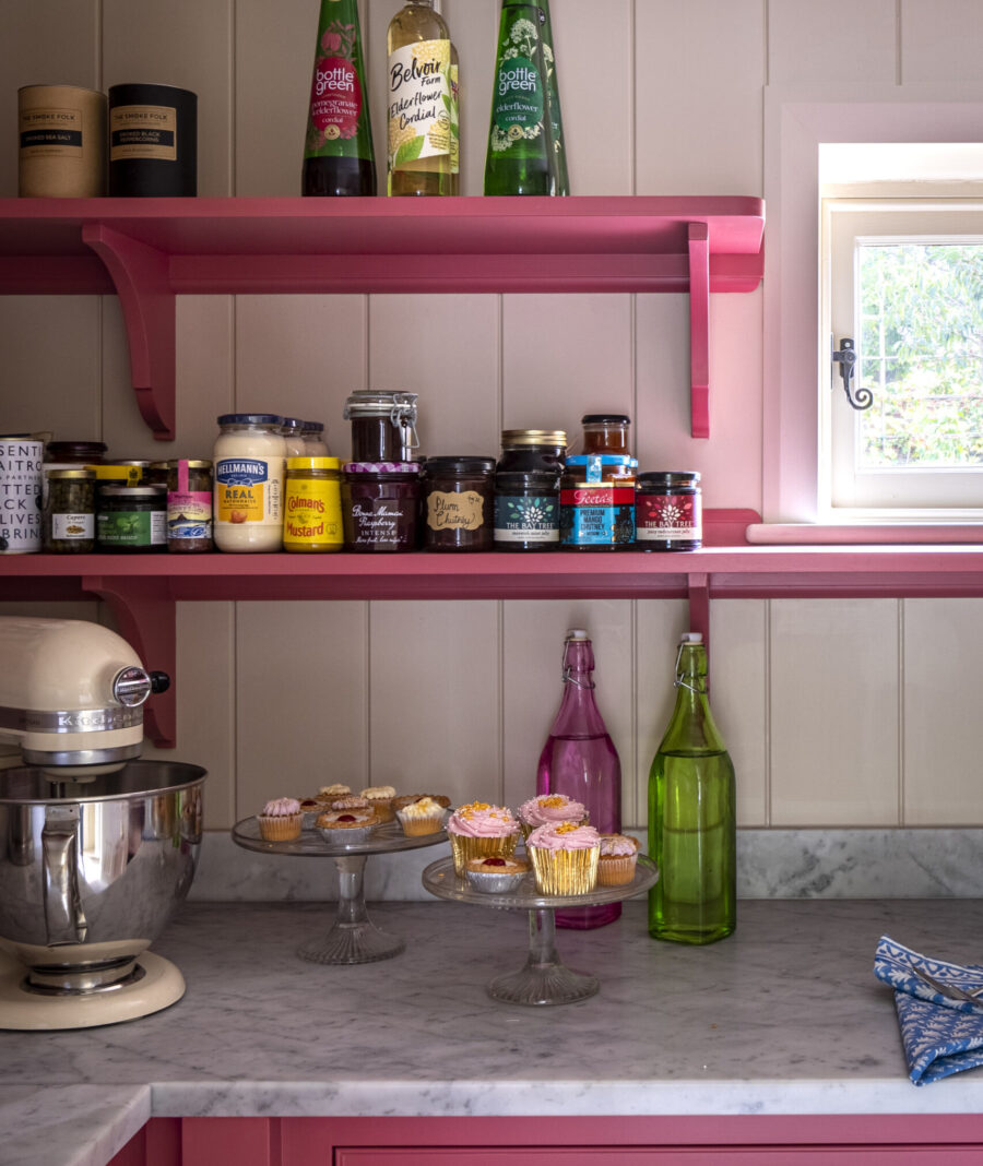 Hand painted pink wooden shelves with marble worktop Hand painted pink wooden shelves with marble worktop
