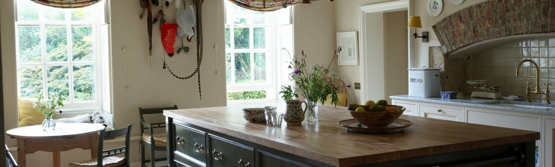 cooks table island located in a bespoke handmade kitchen