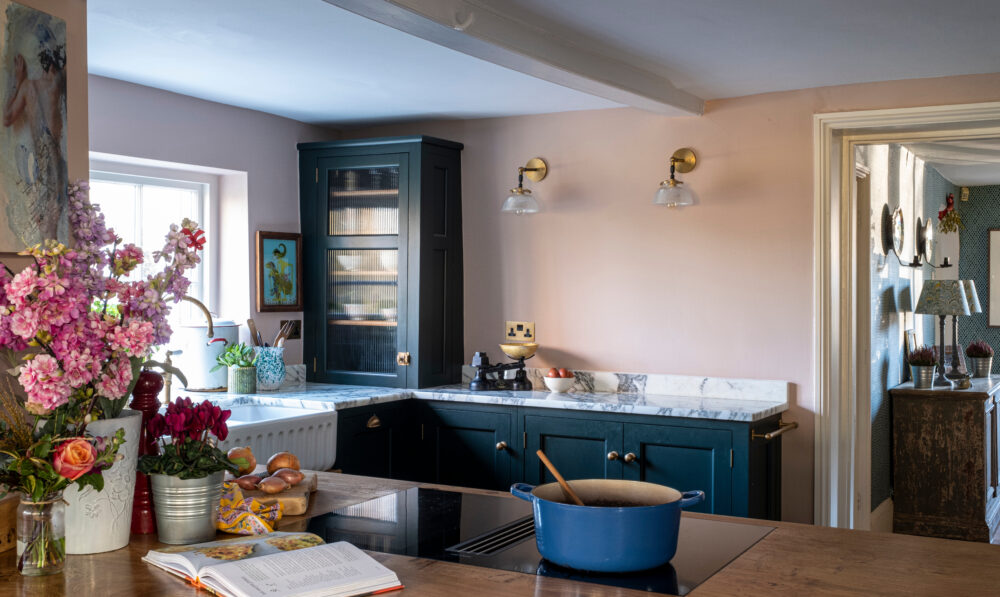 a cottage kitchen with dark cabinets