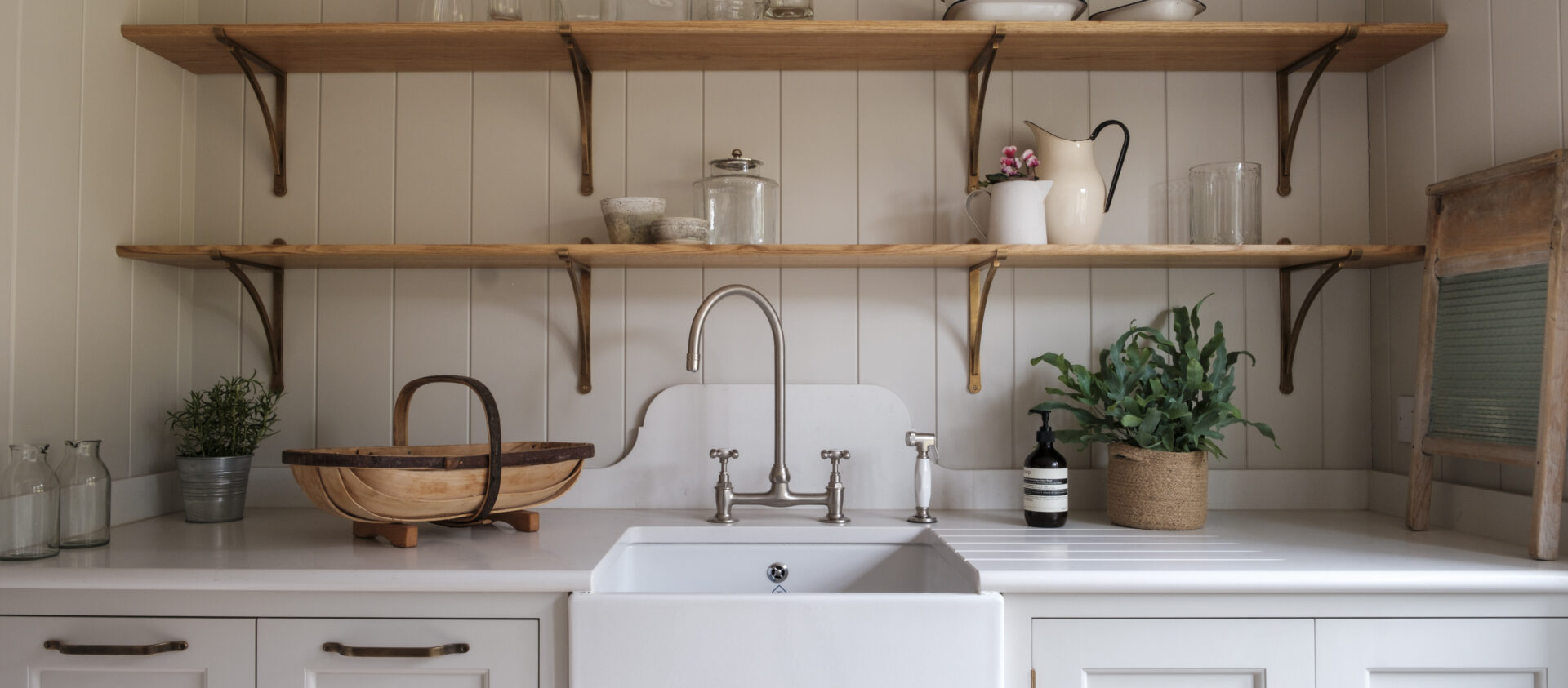 Scullery in a bespoke kitchen in Hampshire with butlers sink and oak shelving