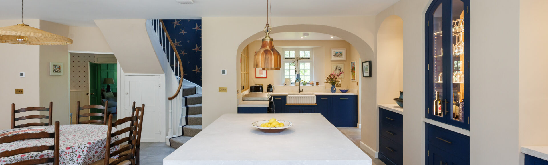 Blue hand painted Cornish kitchen with Barneby Gates wallpapers