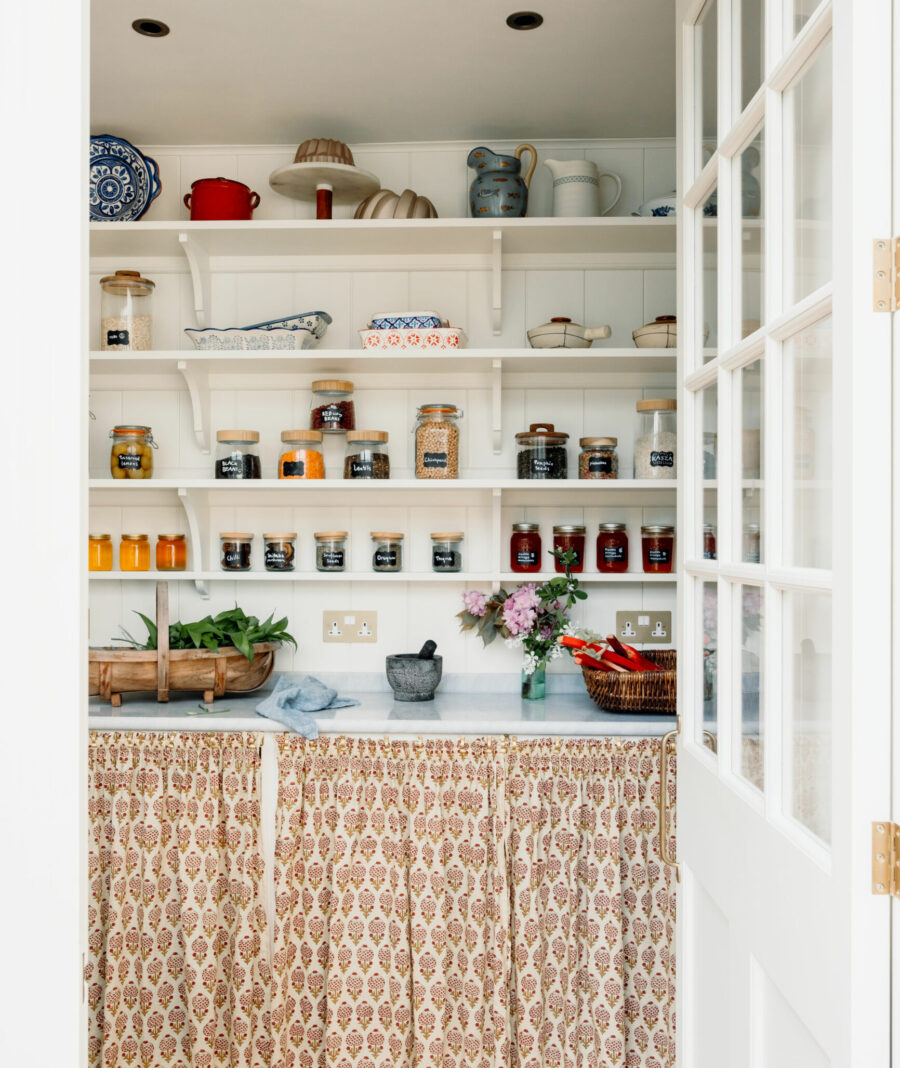 A glazed Walk-In Kitchen Pantry with various shelf depths
