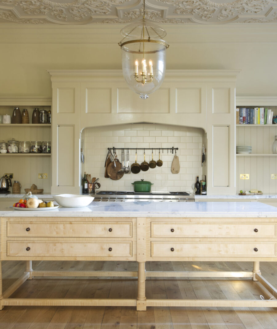 This extra large feature cooker hood covers both the range cooker and the induction hob making a bold feature central to the kitchen design