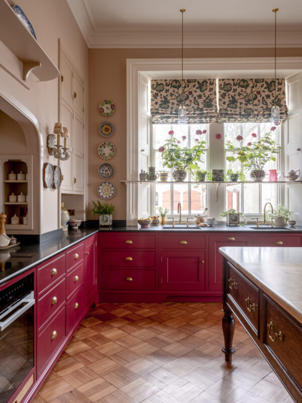 Guild Anderson estate cabinetry with bespoke shelf across a sash window to display ceramics and plants