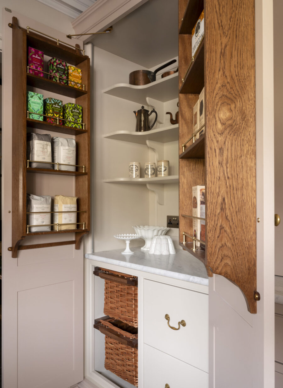 Bespoke kitchen larder cabinet with polished oak shelves