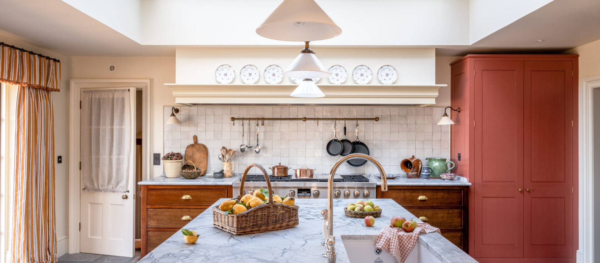 Country Farmhouse kitchen with large marble topped kitchen island
