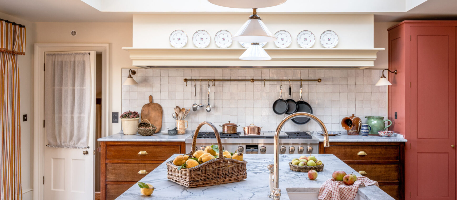 A Somerset Farmhouse kitchen with large orangery style roof lantern and marble topped kitchen island