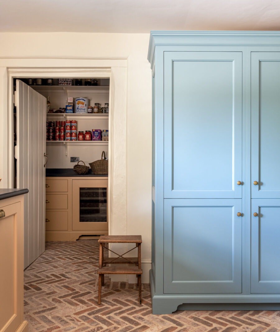 Farmhouse Kitchen Scullery with blue cabinet hiding a fridge/freezer Farmhouse Kitchen Scullery with blue cabinet hiding a fridge/freezer
