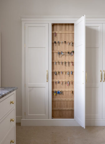 Tall kitchen storage cupboard designed to store keys