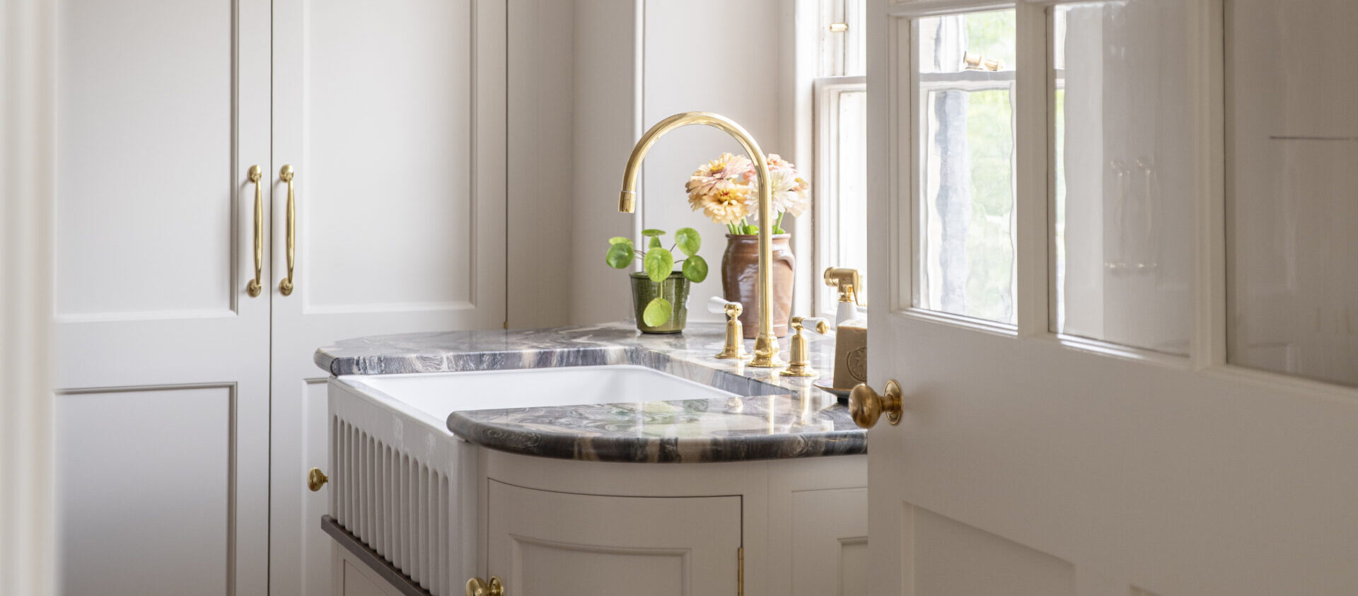 view through to the Regency villa laundry room with the storage cupboard shut