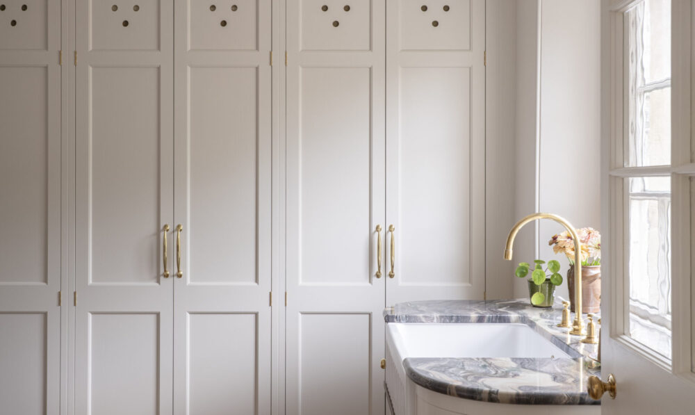 view through to the Regency villa laundry room with the storage cupboard shut