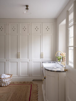 Regency Villa laundry room with Butlers sink and washing basket