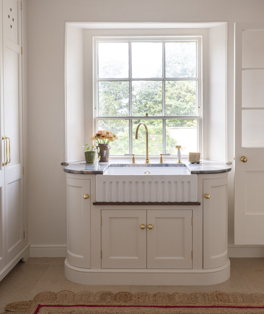 A Guild Anderson laundry room with a Tate & Darby scallop jute rug A Guild Anderson laundry room with a Tate & Darby scallop jute rug