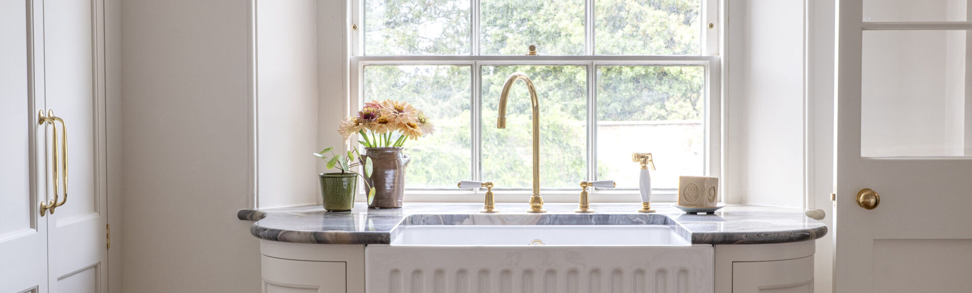 Bespoke laundry room design for a Regency villa with Butlers sink under a sash window
