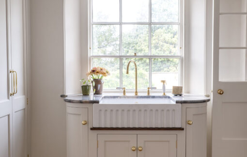 Bespoke laundry room design for a Regency villa with Butlers sink under a sash window