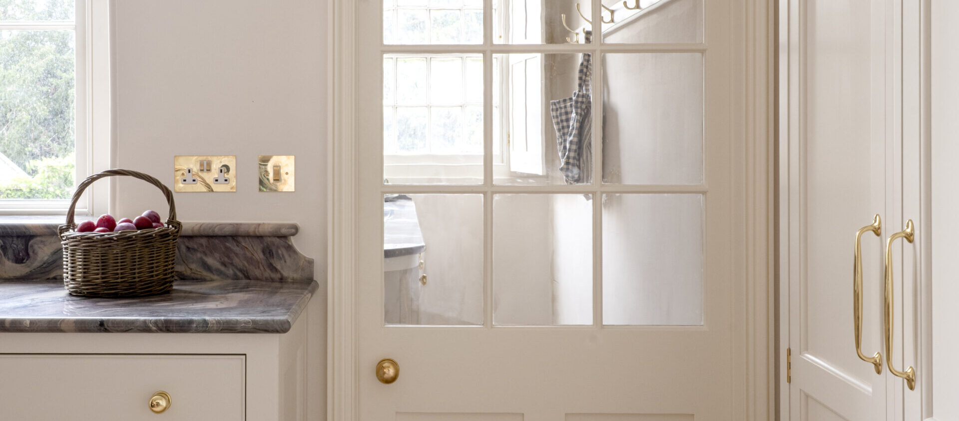View from the Regency Villa kitchen through to the pantry shelving beyond with door closed