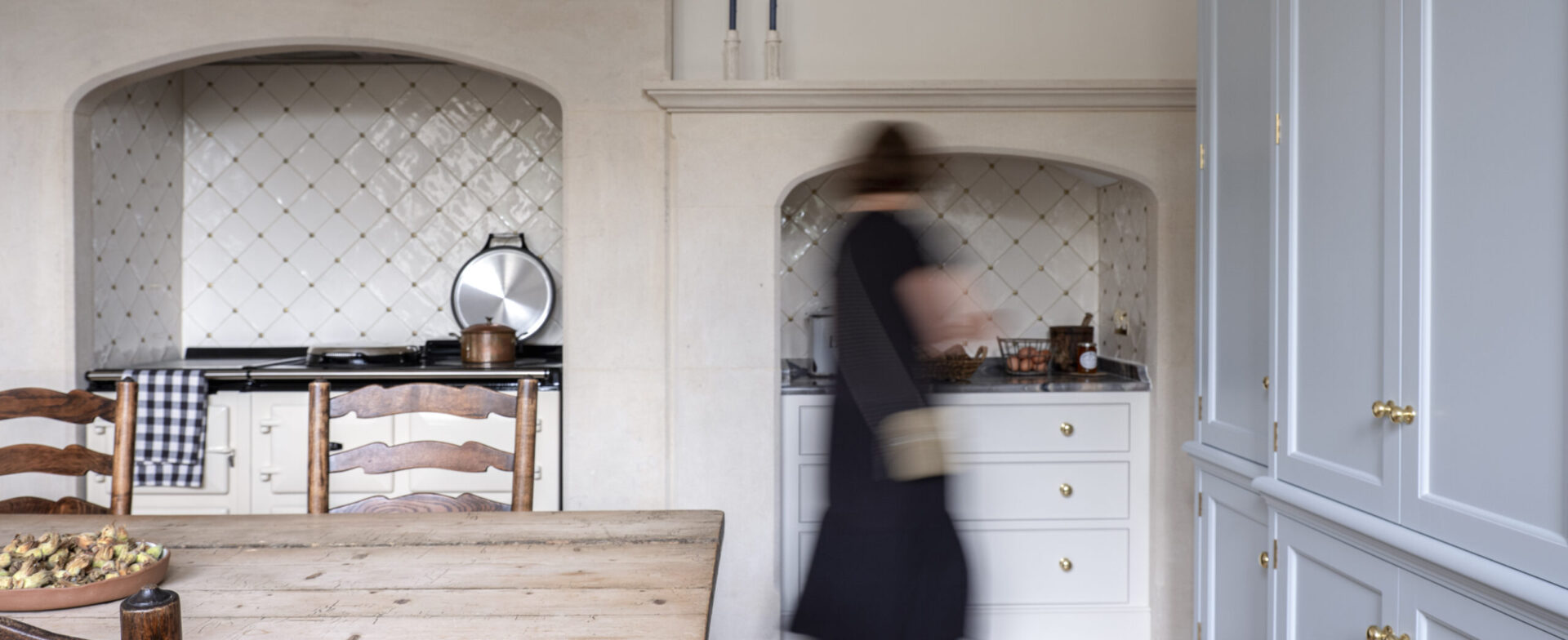 An Aga hidden within a stone chimney breast