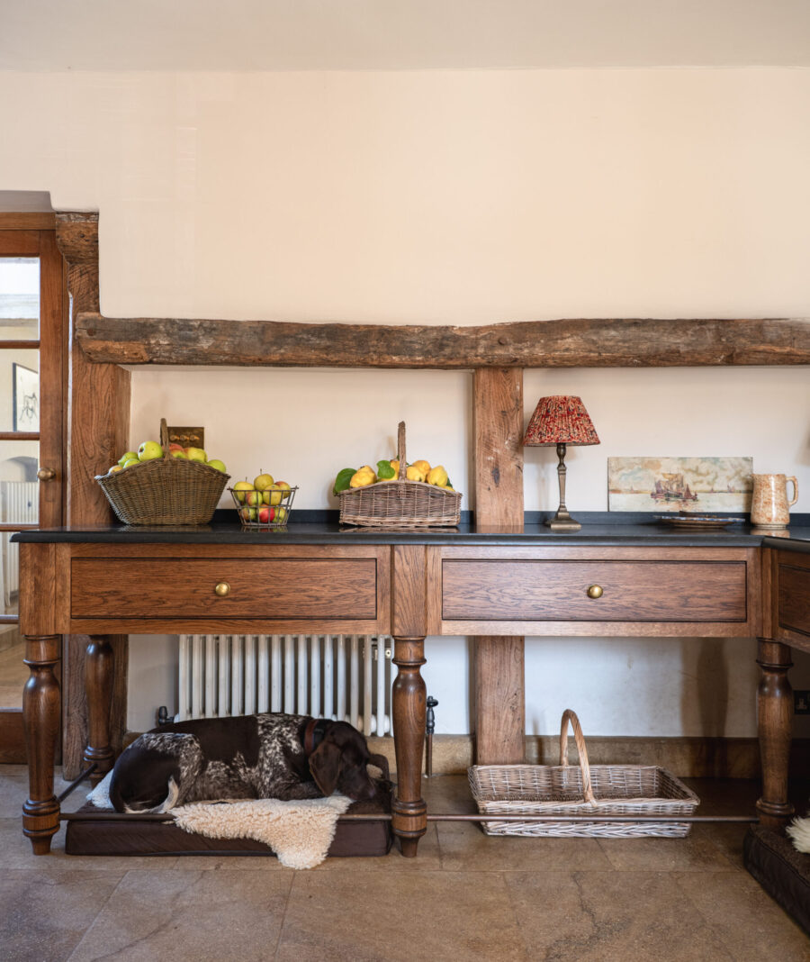 Bespoke details include oak cabinets, open spaces for dog beds, granite worktops and brass handles Bespoke details include oak cabinets, open spaces for dog beds, granite worktops and brass handles