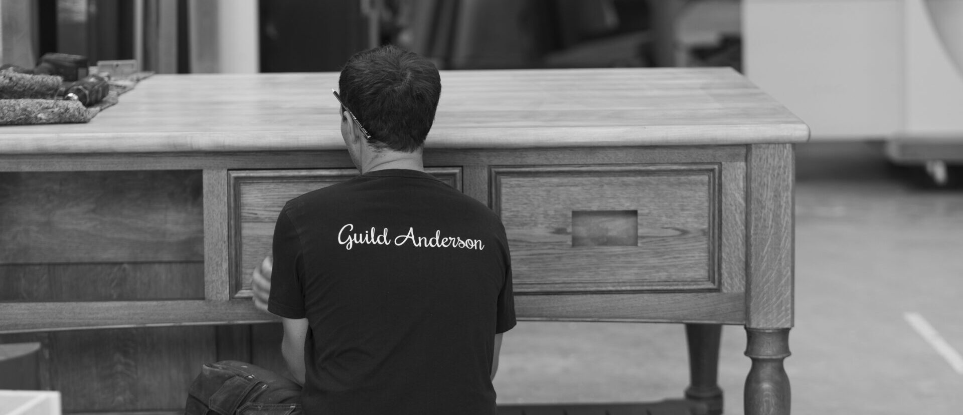 Guild Anderson workshop member completing a Cook's Table kitchen island