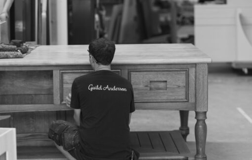 Guild Anderson workshop member completing a Cook's Table kitchen island