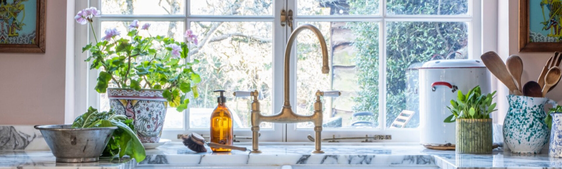 Bespoke sink area with brass taps in a Guild Anderson cottage kitchen