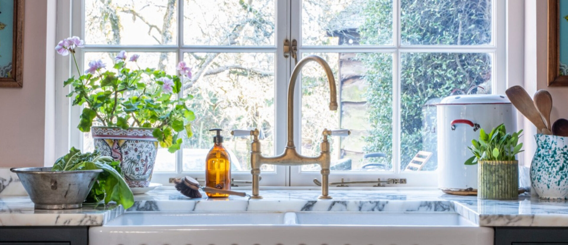 Bespoke sink area with brass taps in a Guild Anderson cottage kitchen