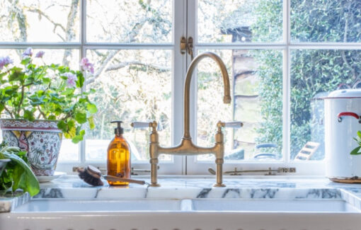 Bespoke sink area with brass taps in a Guild Anderson cottage kitchen