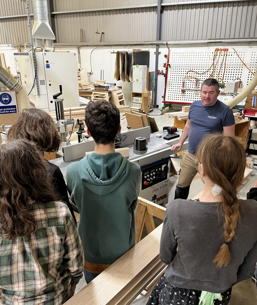The National Saturday Club Qest members in the Guild Anderson workshop