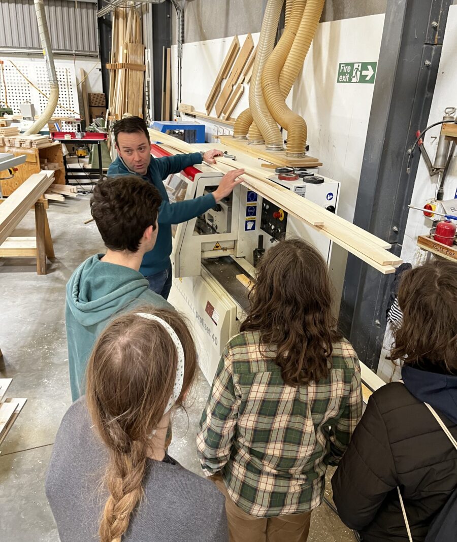 Students being shown the Guild Anderson workshop