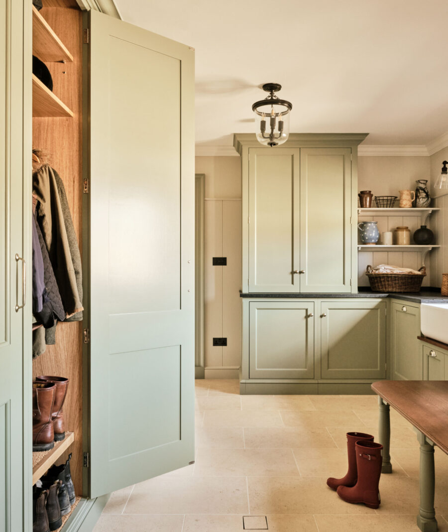 A multifunctional boot room with oak topped bench and tall wardrobe cabinets A multifunctional boot room with oak topped bench and tall wardrobe cabinets