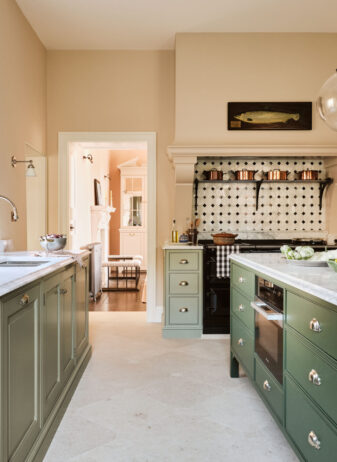 Under the traditional Georgian sash side window, is a handmade, contemporary stainless steel under mounted kitchen sink Under the traditional Georgian sash side window, is a handmade, contemporary stainless steel under mounted kitchen sink