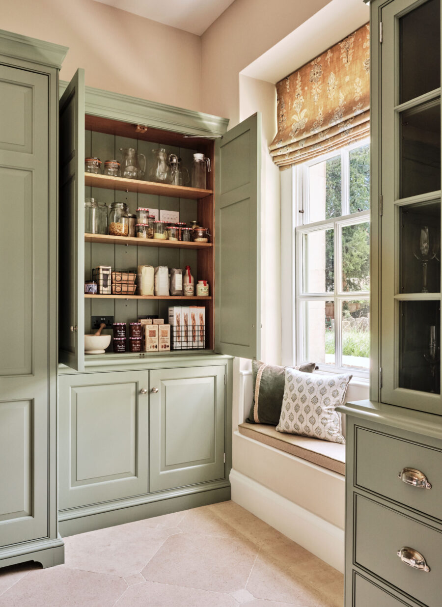 Ample storage options are incorporated in to tall traditionally designed bespoke cabinetry Ample storage options are incorporated in to tall traditionally designed bespoke cabinetry
