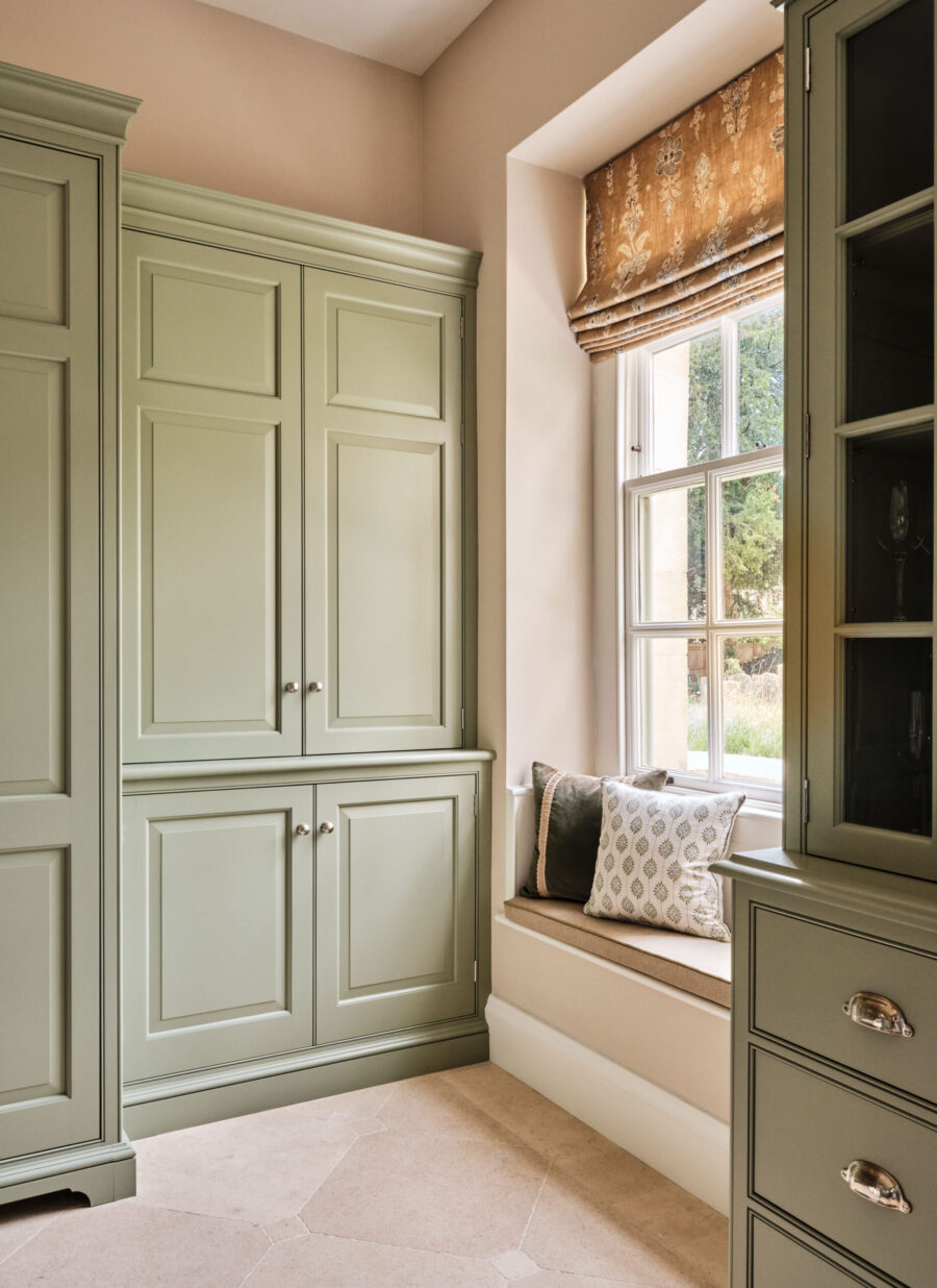 Tall traditionally designed bespoke cabinets house a selection of shelves and base cupboards Tall traditionally designed bespoke cabinets house a selection of shelves and base cupboards
