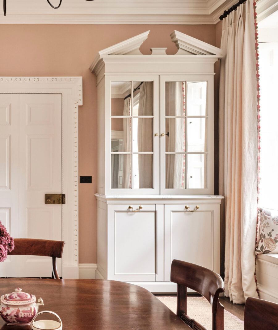 Classically proportioned bespoke cabinetry hide integrated appliances and space for coffee machines